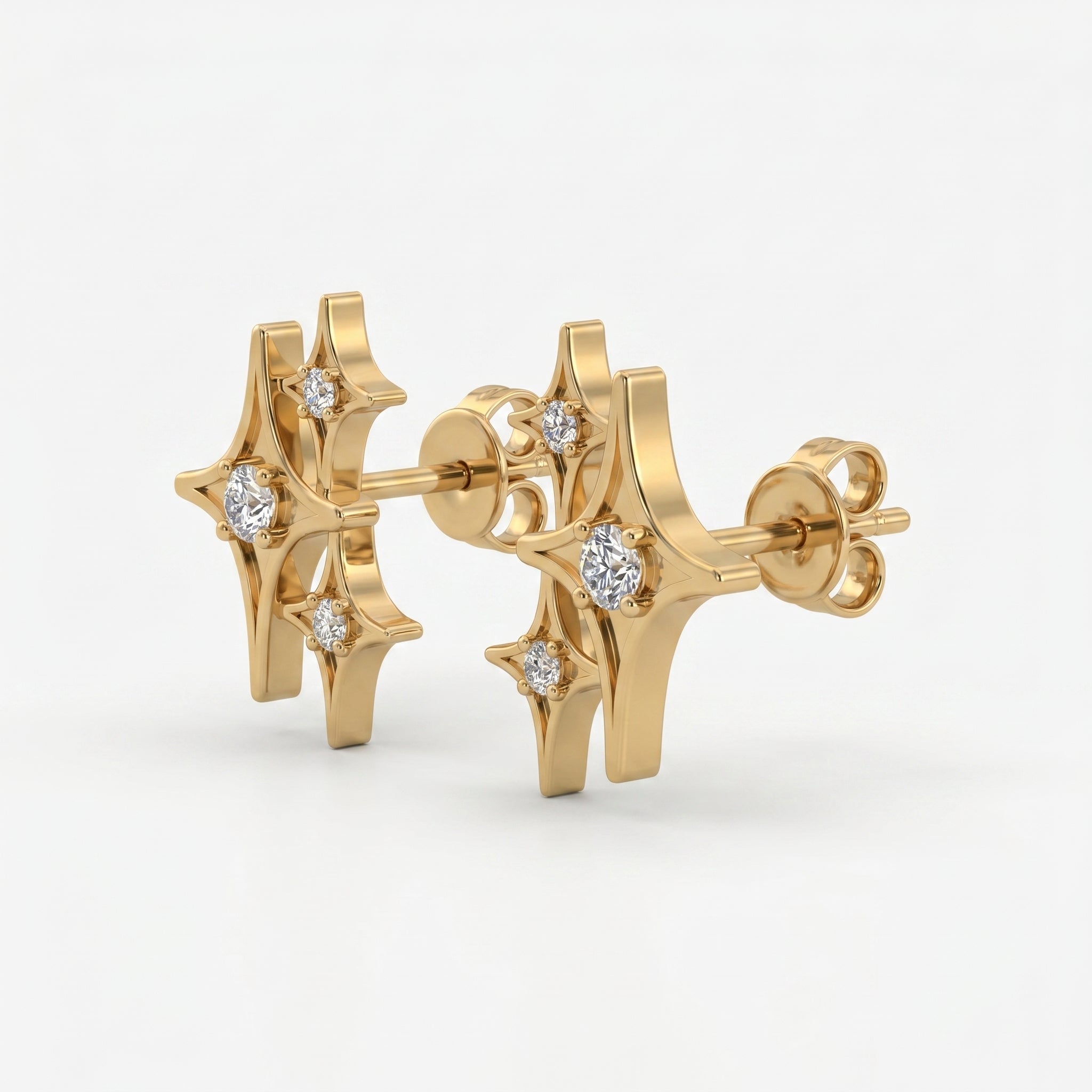 Gold starburst stud earrings at 45-degree angle showing layered celestial design and sparkling crystal details