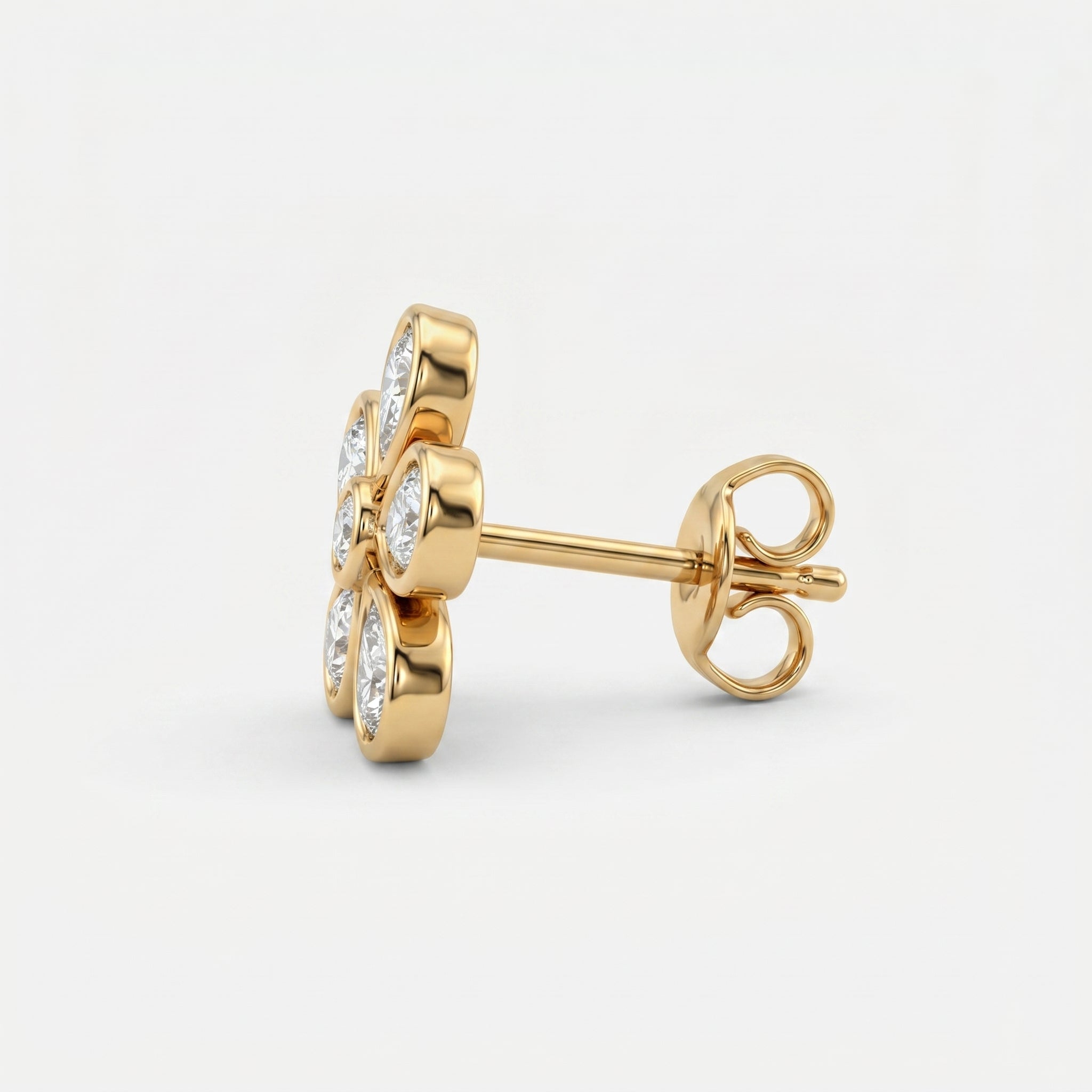 Yellow gold floral diamond stud earrings at 45-degree angle showing sparkle and premium craftsmanship