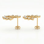 45-degree view of gold diamond spiral earrings with pear-shaped stones and polished luxury finish