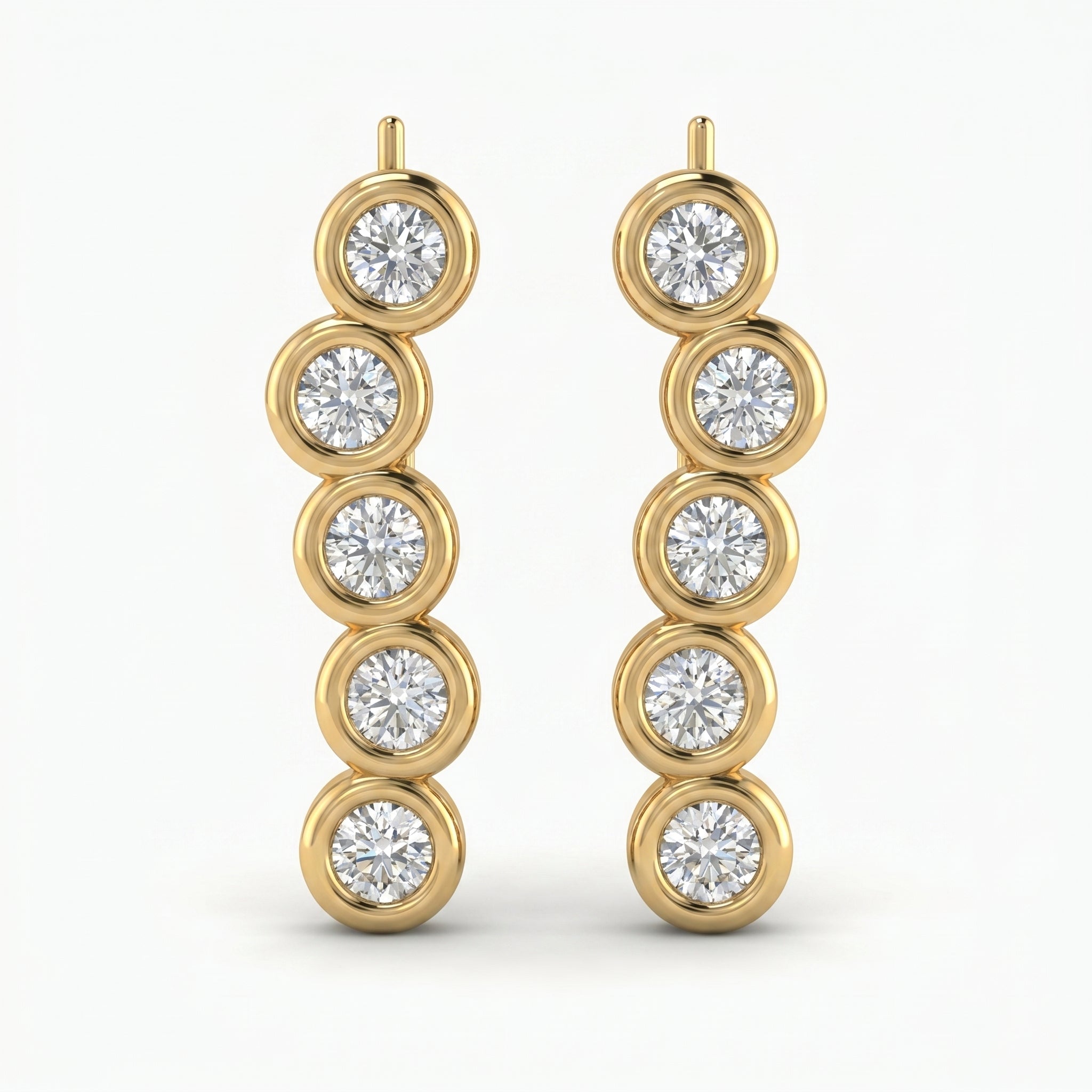 Luxury yellow gold ear crawler earrings with round bezel-set diamonds in angled studio product photo