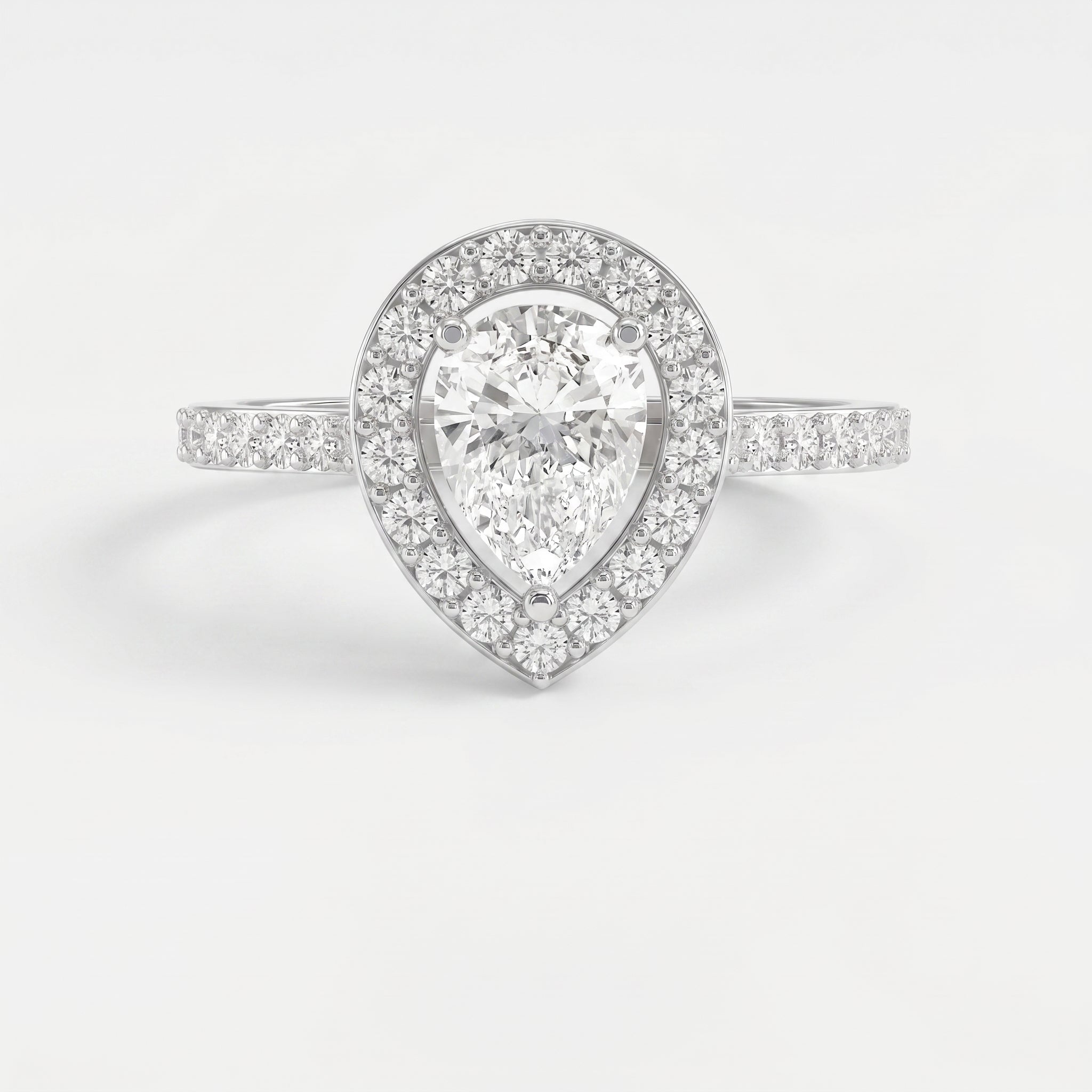 Pear Cut Diamond Side Stone Engagement Ring