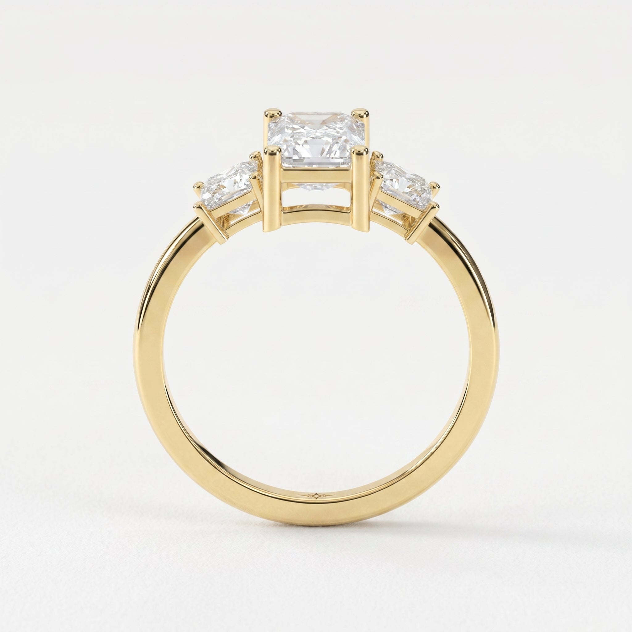 The Axis Trio Emerald Ring