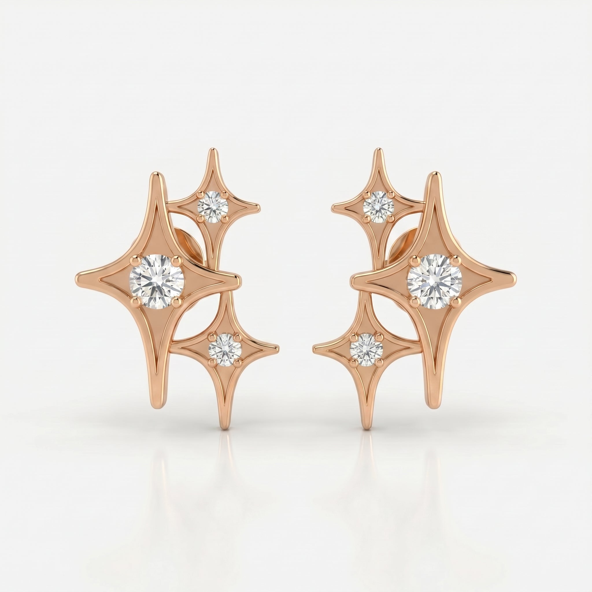 Rose gold celestial diamond stud earrings with triple starburst design on clean white background