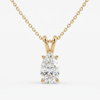 Gold necklace with a pear-shaped diamond pendant on a white background