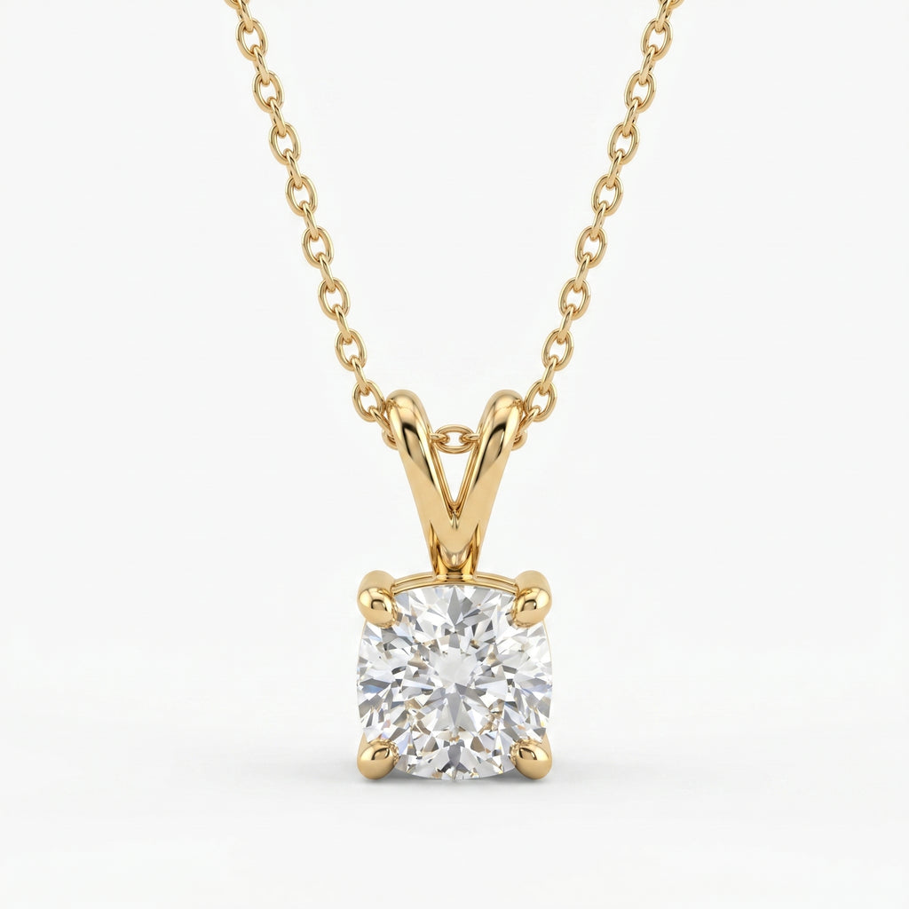 Gold necklace with a diamond pendant on a white background
