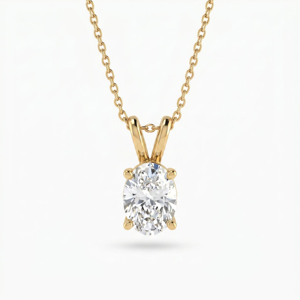 Gold necklace with a diamond pendant on a white background