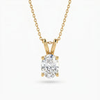 Gold necklace with a diamond pendant on a white background