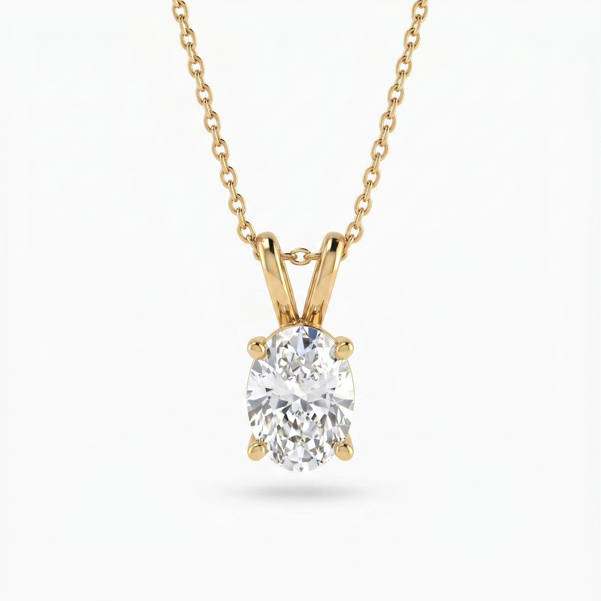 Gold necklace with a diamond pendant on a white background