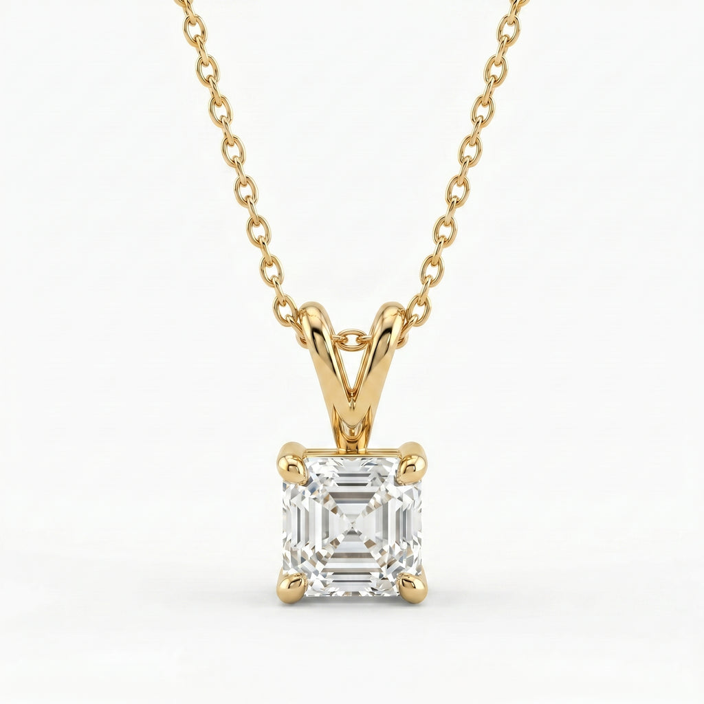Gold necklace with a diamond pendant on a white background