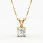 Gold necklace with a diamond pendant on a white background