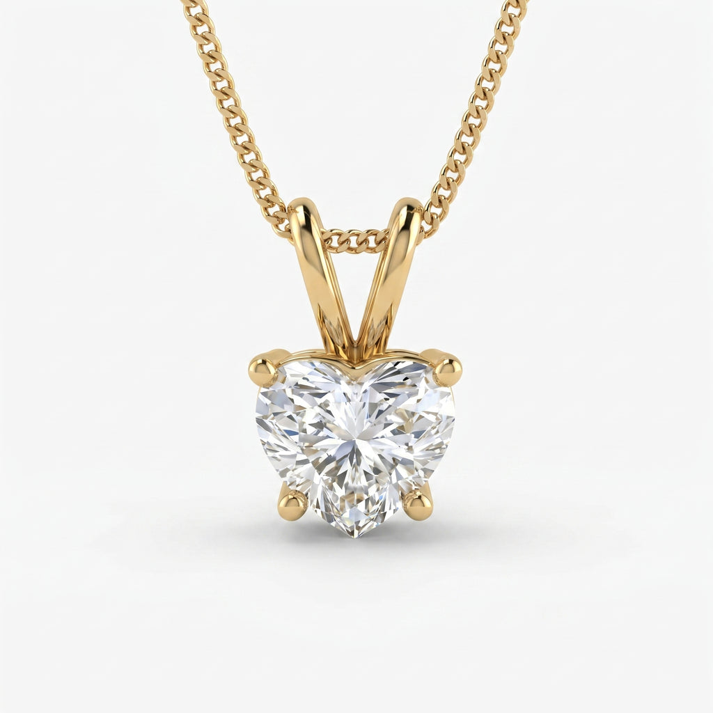 Gold necklace with a heart-shaped diamond pendant on a white background