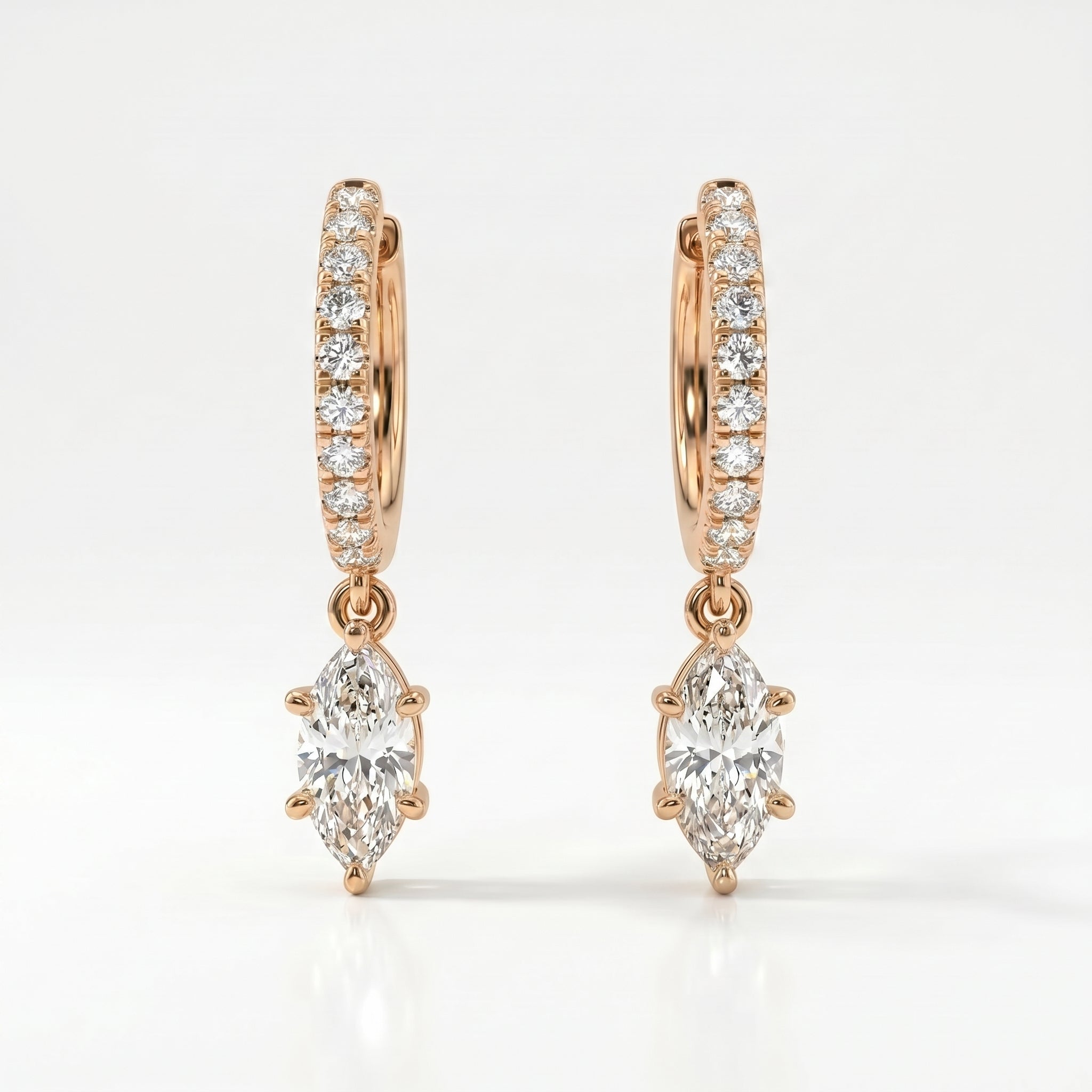 Rose gold marquise diamond drop hoop earrings with pavé diamonds on a clean white luxury jewelry background