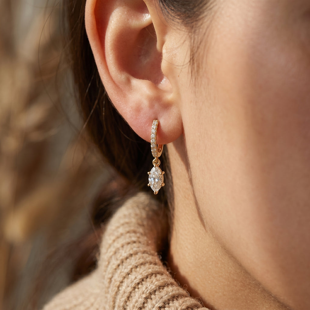 Side profile of pavé diamond hoop earrings showing secure clasp and fine jewelry craftsmanship