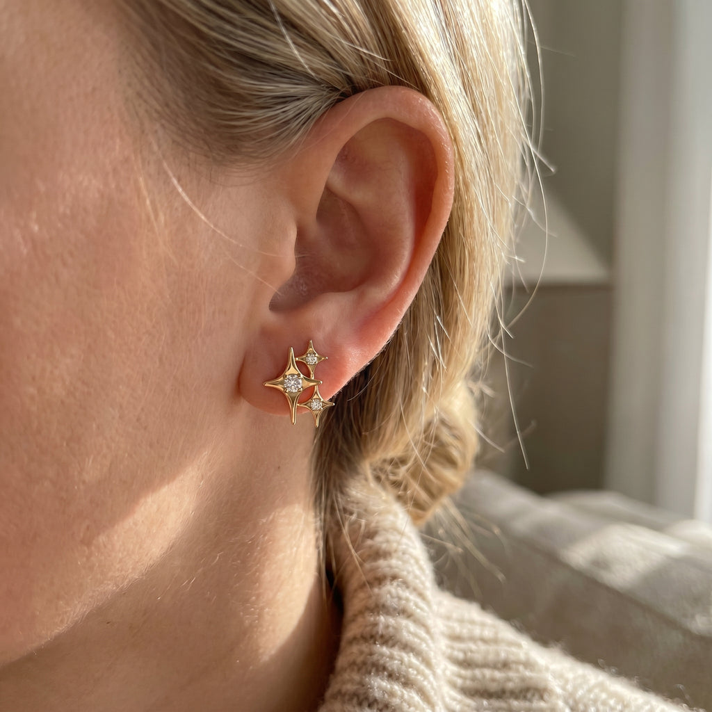 Side profile of celestial diamond earrings showing polished gold finish and fine jewelry craftsmanship
