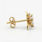Side profile of gold diamond stud earrings showing secure prong settings and polished luxury craftsmanship
