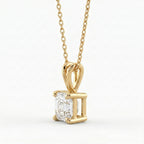 Gold pendant with a diamond on a white background