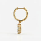 Side profile of yellow gold diamond hoop earrings showing secure prong settings and craftsmanship details
