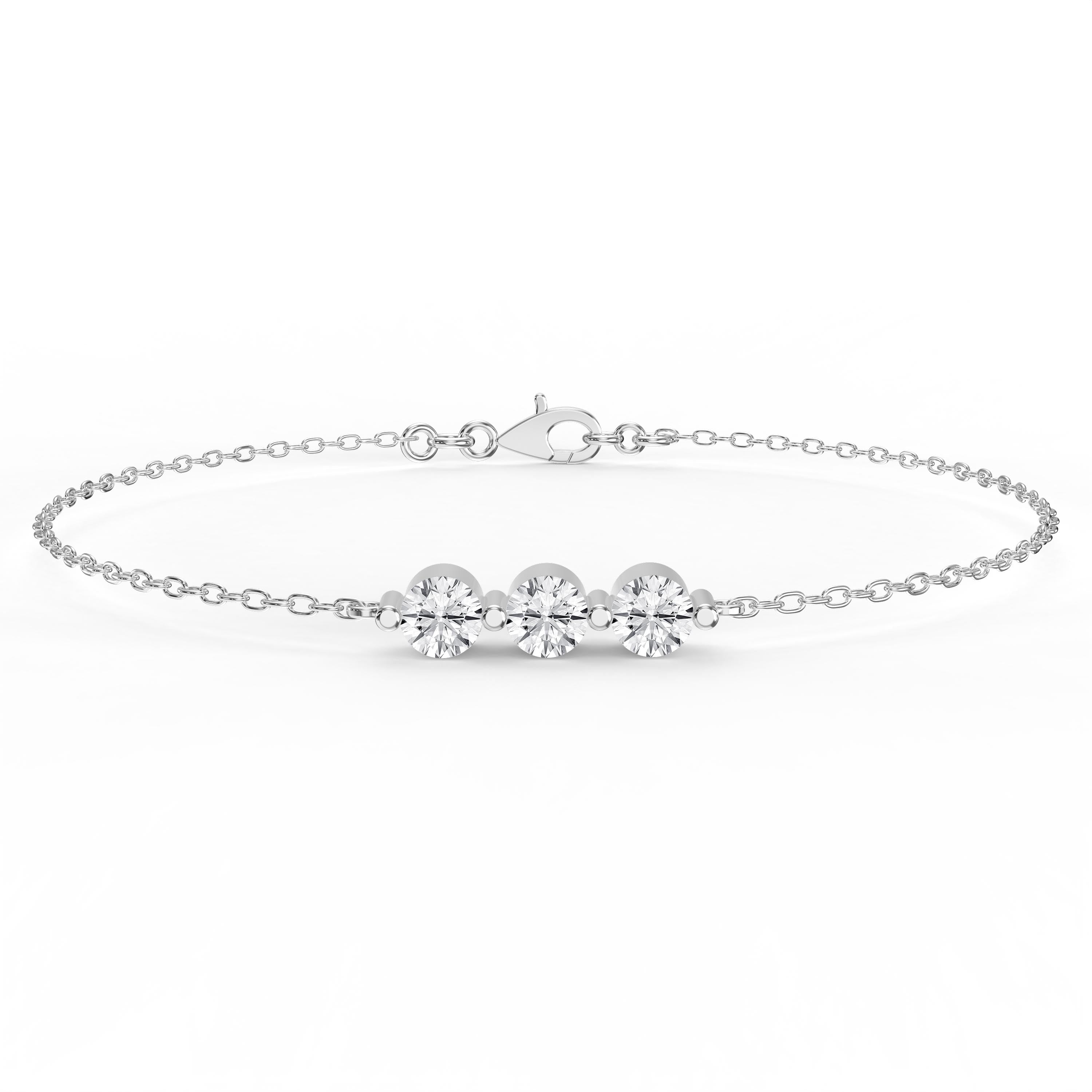 Silver bracelet with three clear gemstones on a white background