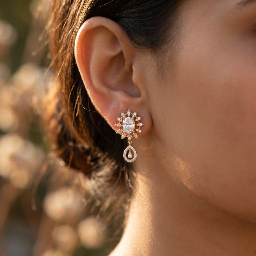 Side profile of rose gold floral drop earrings highlighting elevated gemstone settings and premium craftsmanship