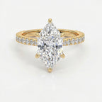 Marquise cut diamond engagement ring in yellow gold with pavé diamond band and secure six-prong setting.