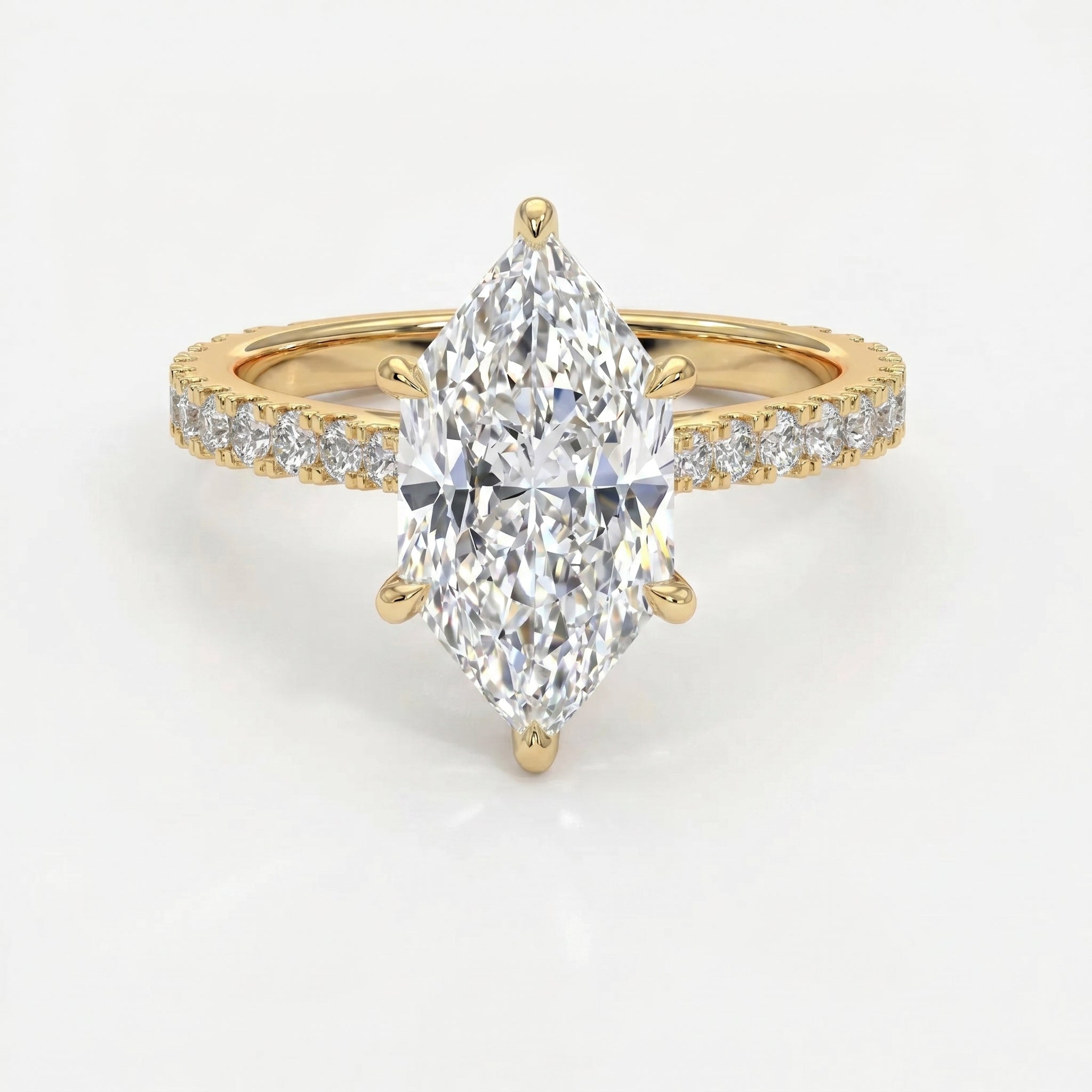 Marquise cut diamond engagement ring in yellow gold with pavé diamond band and secure six-prong setting.
