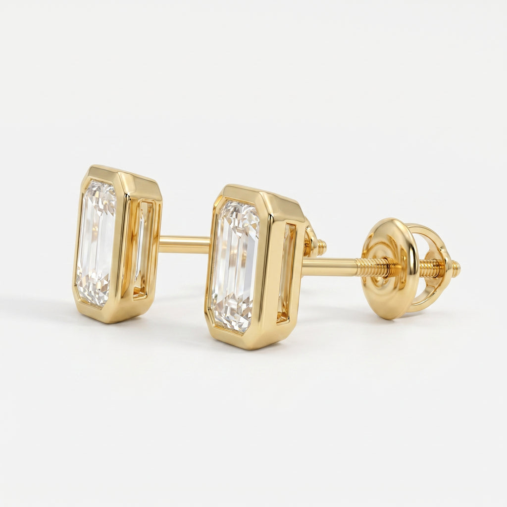 Gold earrings with emerald-cut diamonds on a white background