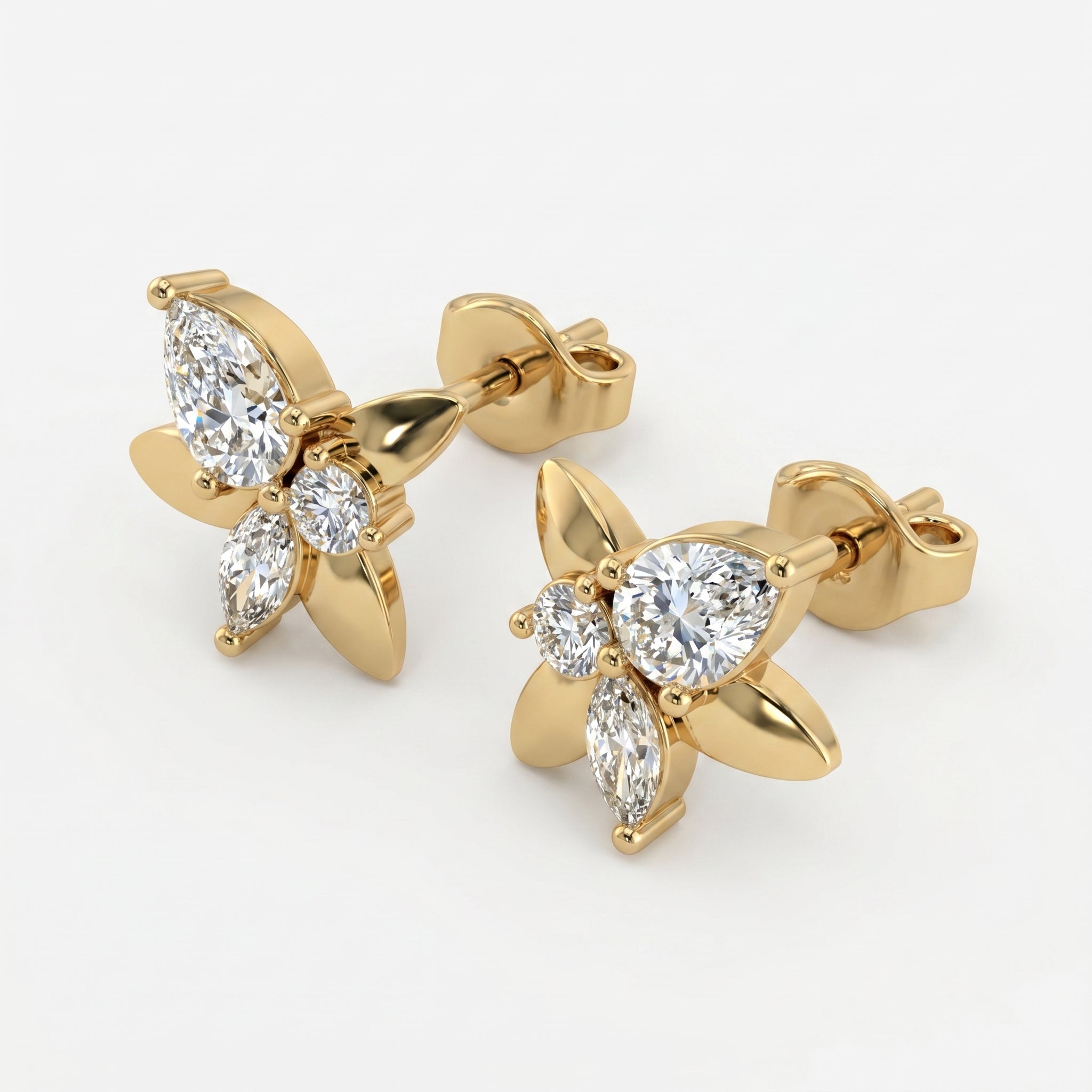 Luxury butterfly diamond earrings in yellow gold shown at elegant angled perspective