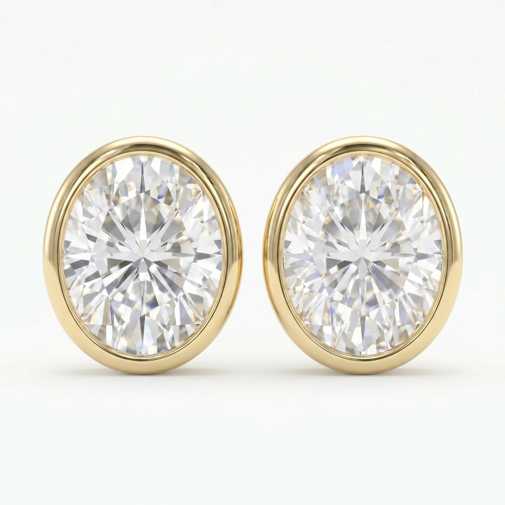 Pair of diamond stud earrings with gold rims on a white background