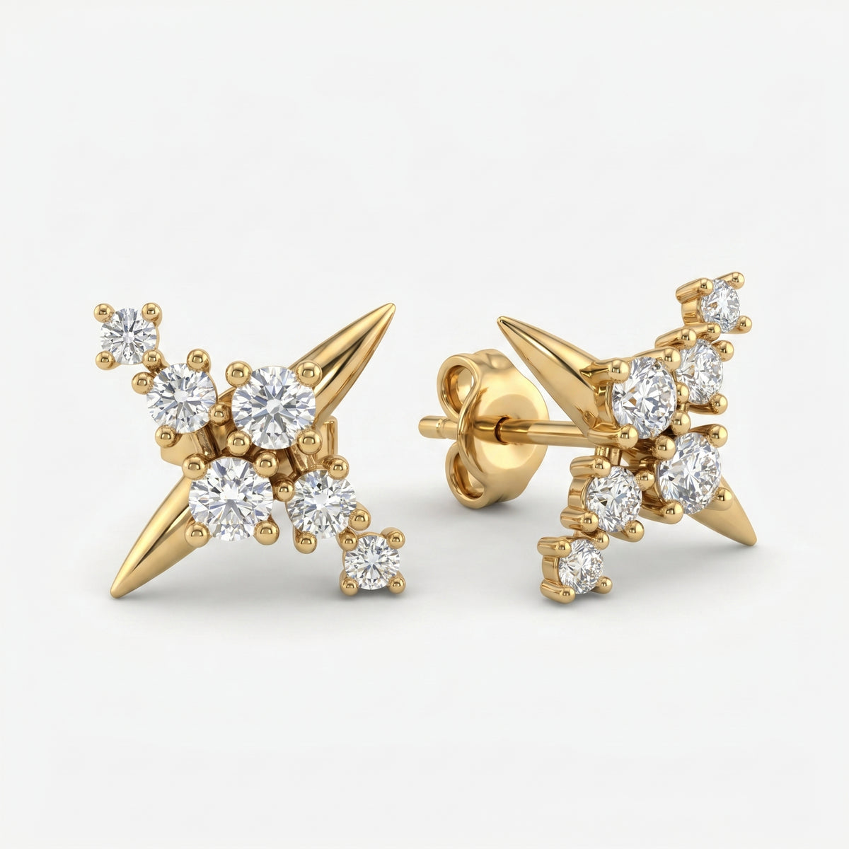 45-degree view of yellow gold diamond cluster stud earrings with modern spike detail and brilliant round stones