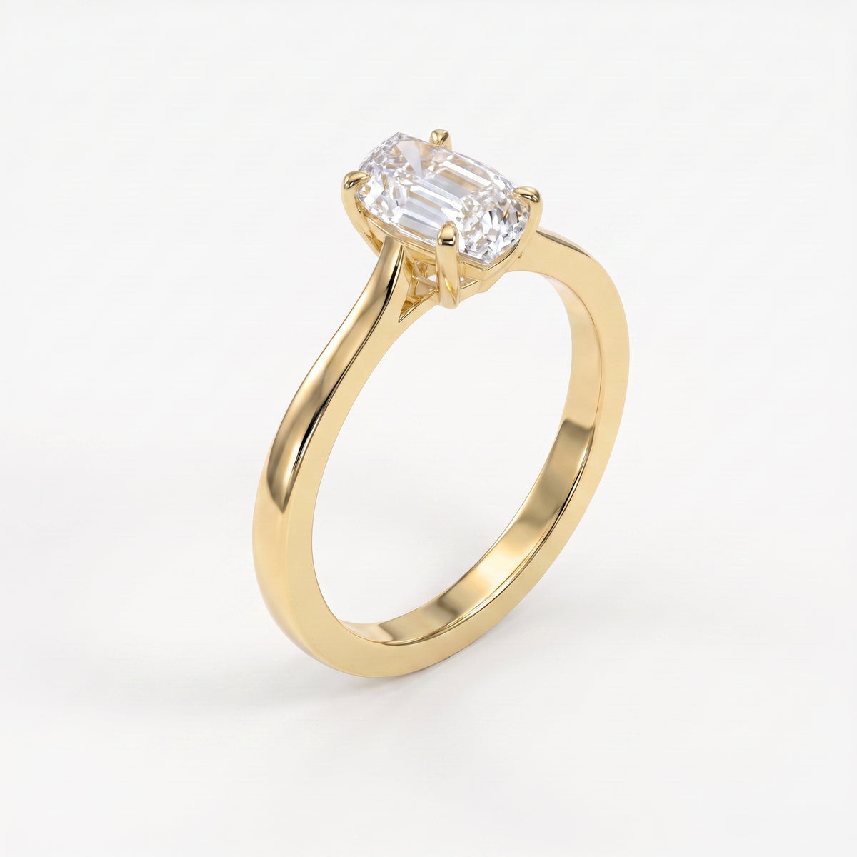 Flame cut diamond solitaire engagement ring in polished yellow gold with four prong setting shown at 45 degree angle.