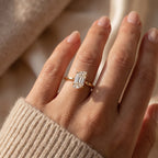 Flame cut diamond solitaire engagement ring in polished yellow gold worn on hand with elegant minimalist design.