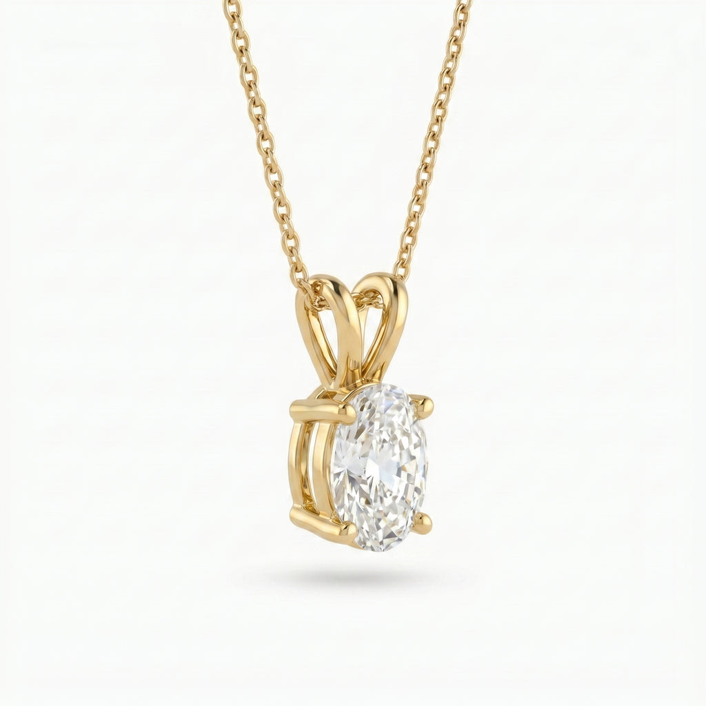 Gold pendant with a diamond on a white background