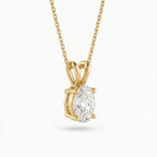 Gold pendant with a diamond on a white background