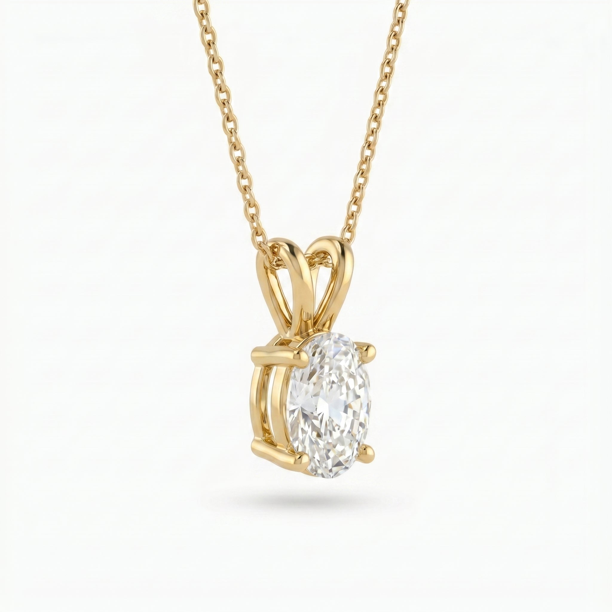 Gold pendant with a diamond on a white background