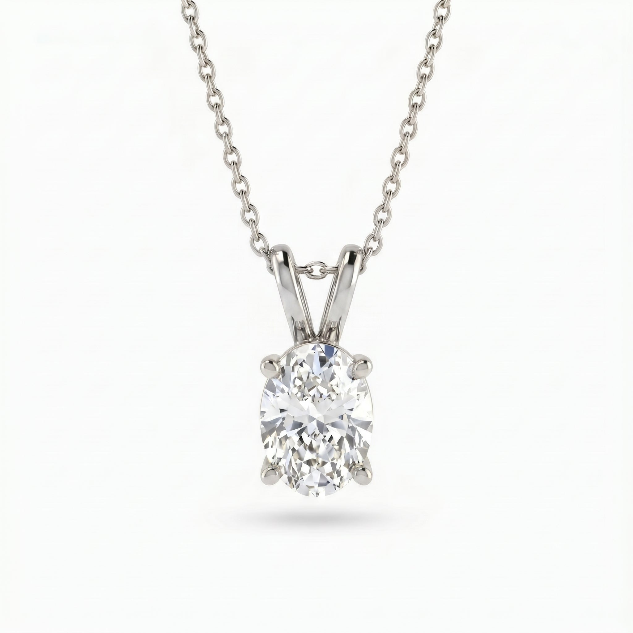Diamond pendant on a chain against a white background