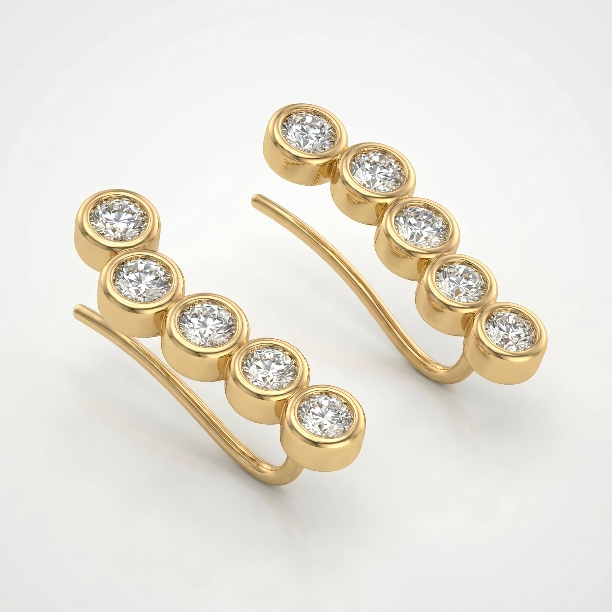 Side profile of yellow gold diamond ear climber earrings with polished bezel settings and curved hook