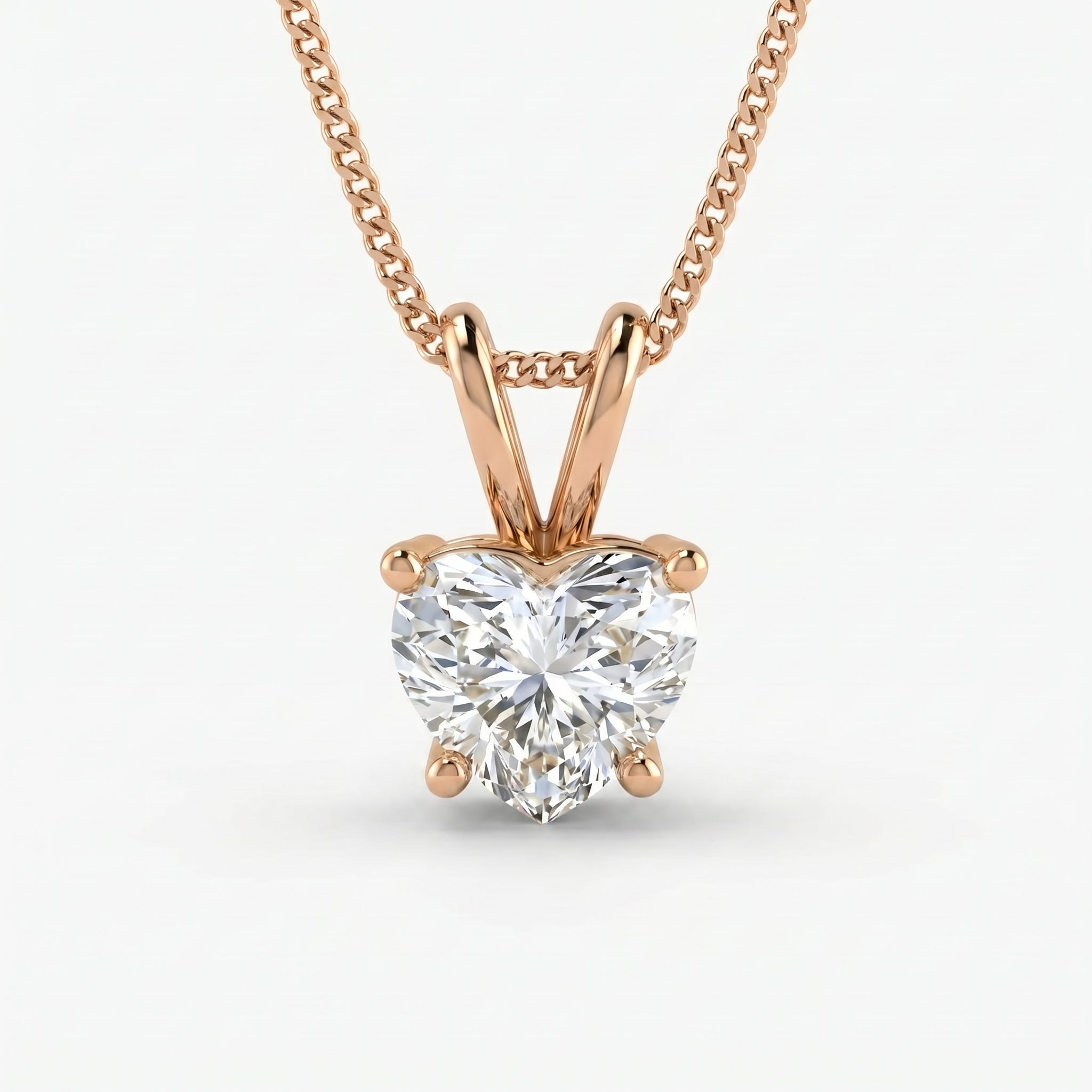 Rose gold necklace with a heart-shaped diamond pendant on a white background