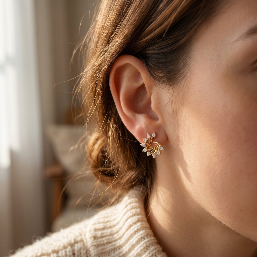 Side profile of Yellow gold diamond swirl earrings highlighting premium craftsmanship and stone settings