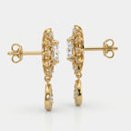 Side profile of luxury gold diamond earrings showing secure prong settings and premium fine jewelry craftsmanship