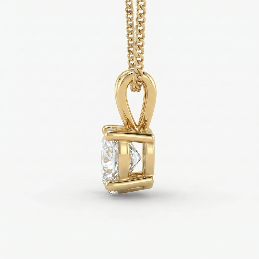 Gold pendant with a diamond on a white background