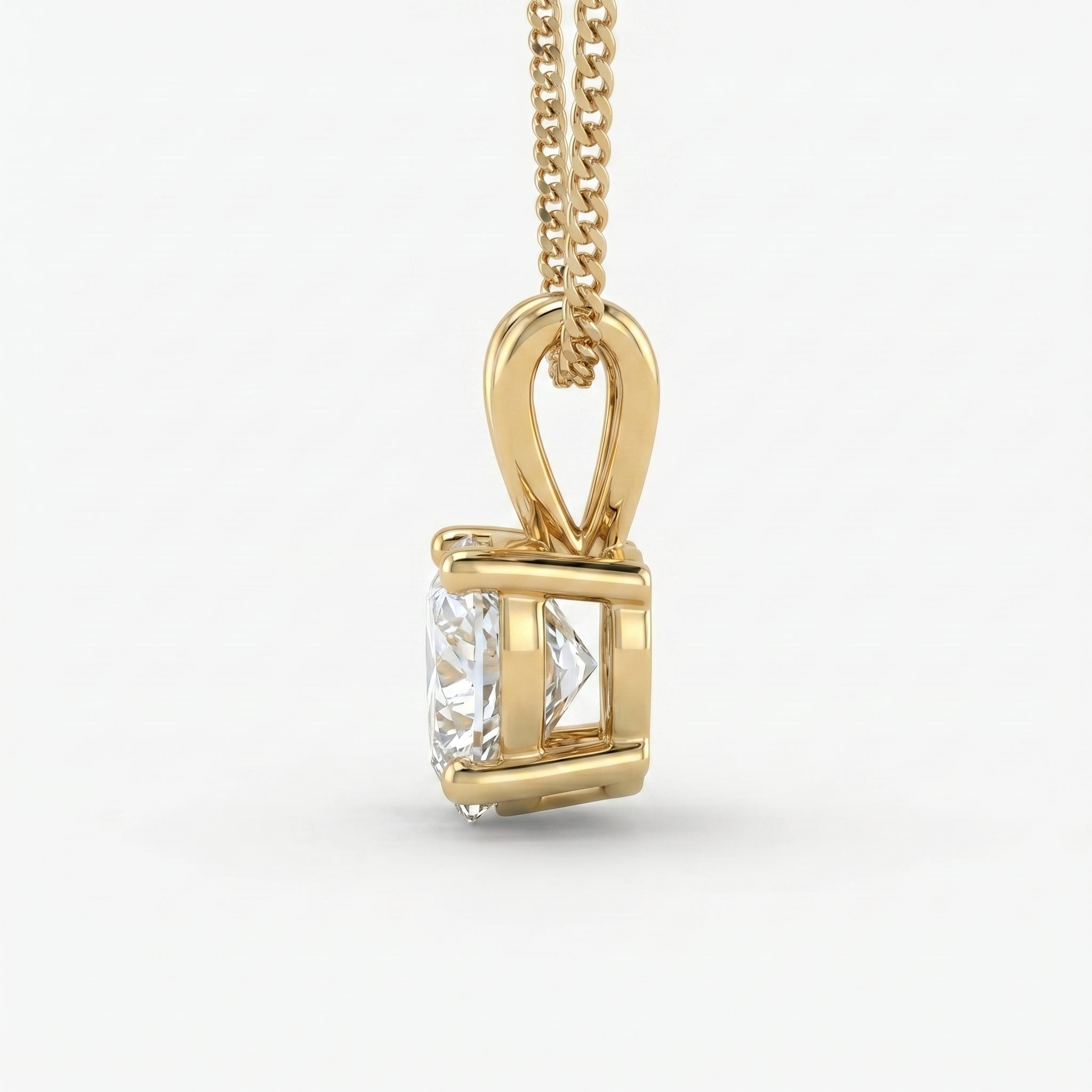 Gold pendant with a diamond on a white background