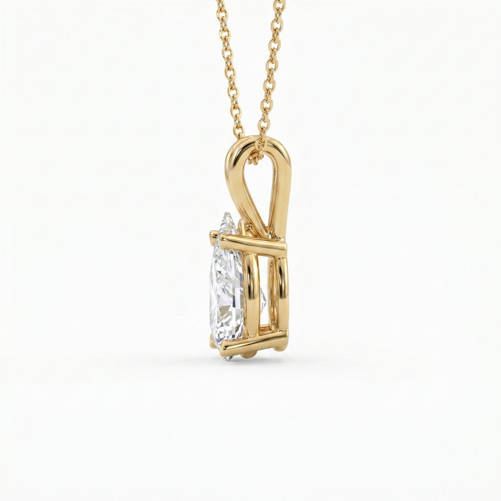 Gold pendant with a diamond on a white background