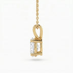 Gold pendant with a clear gemstone on a white background