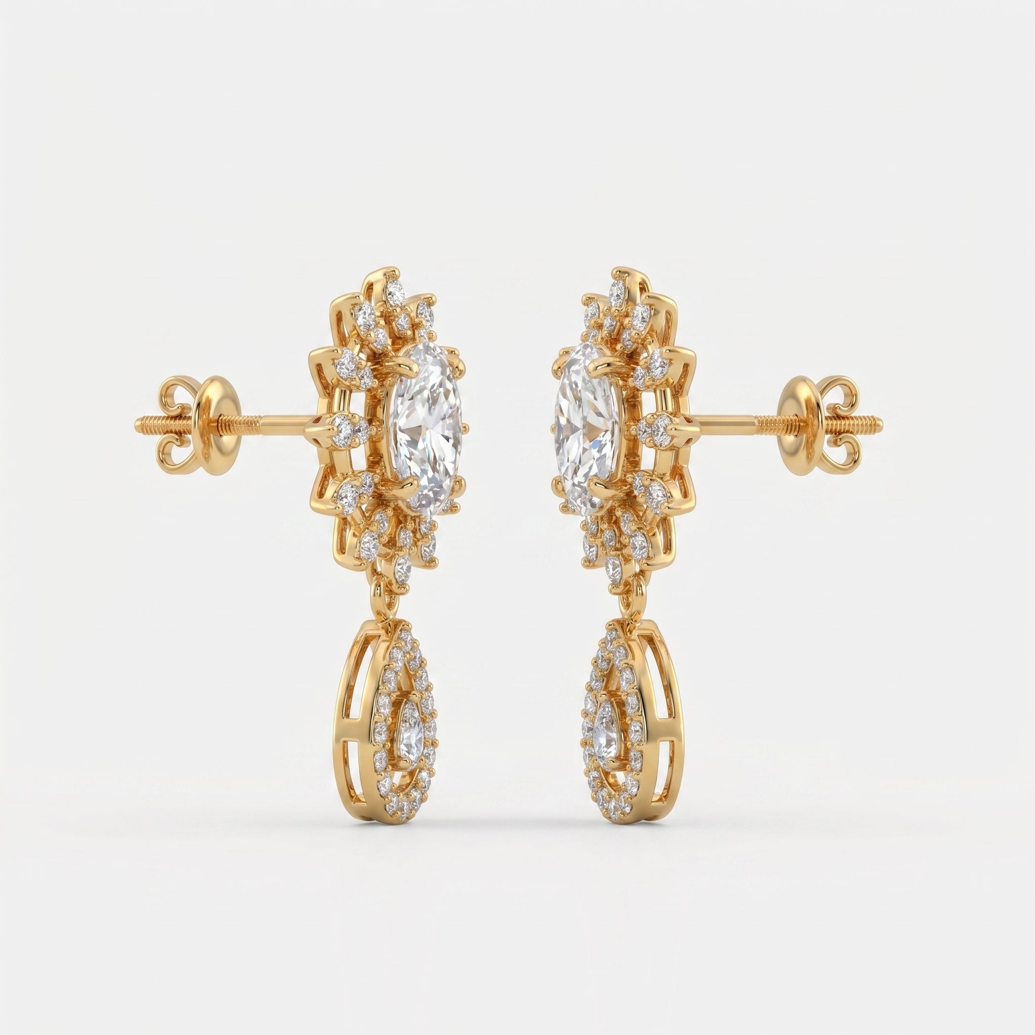 45-degree view of yellow gold diamond drop earrings featuring oval center stones and pavé halo detailing