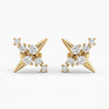 Luxury yellow gold starburst stud earrings with round diamonds on white background, modern fine jewelry design