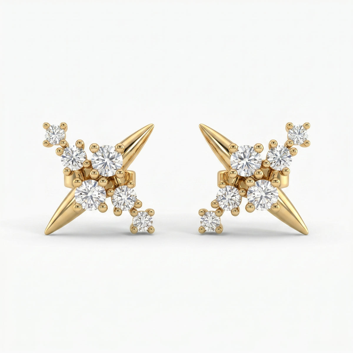 Luxury yellow gold starburst stud earrings with round diamonds on white background, modern fine jewelry design