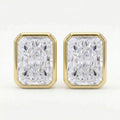 Gold earrings with rectangular diamond-like stones on a white background