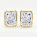 Gold earrings with rectangular diamond-like stones on a white background