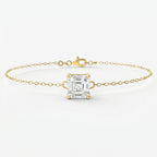 Minimalist yellow gold bracelet with Asscher-cut solitaire gemstone on delicate chain studio front view