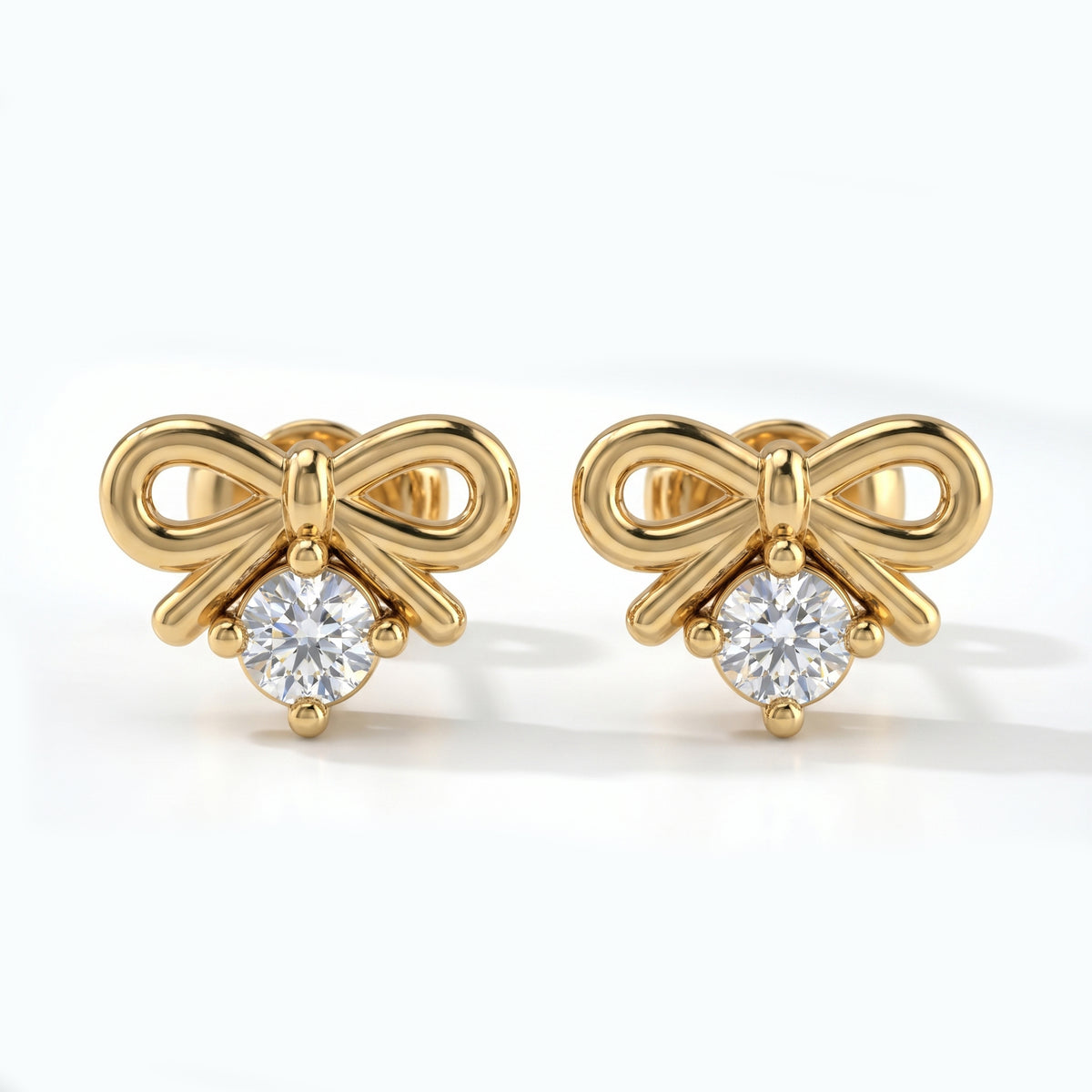 Macro close-up of bow earrings with brilliant round crystal and polished premium metal detailing